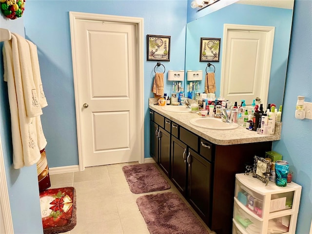 bathroom with tile patterned flooring and vanity