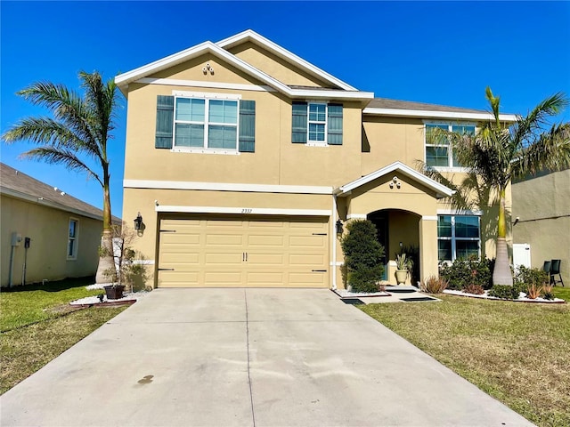 view of front of property featuring a garage and a front lawn