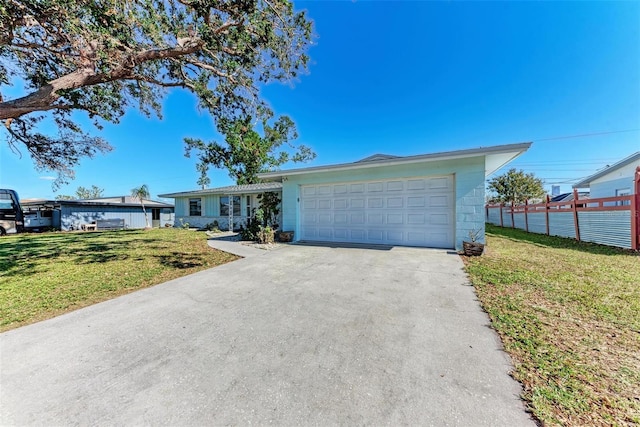 ranch-style home with a garage and a front yard