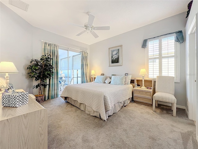 bedroom with ceiling fan and light colored carpet