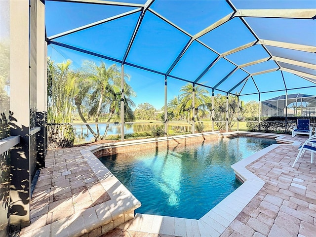 view of swimming pool with a patio and a lanai