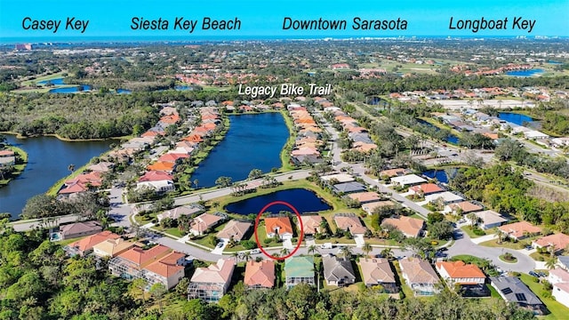 birds eye view of property with a water view