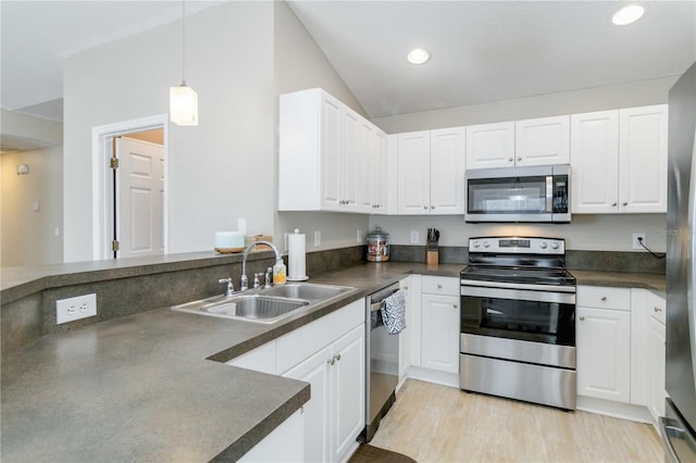 kitchen featuring white cabinetry, sink, and appliances with stainless steel finishes