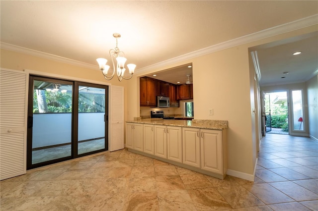 kitchen with a healthy amount of sunlight, stainless steel appliances, light stone counters, and ornamental molding