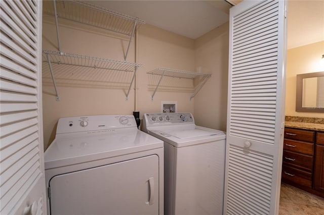 laundry area featuring washing machine and clothes dryer