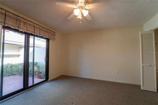 unfurnished room with ceiling fan, carpet floors, and a textured ceiling