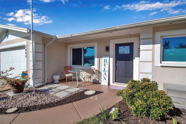 property entrance with a garage