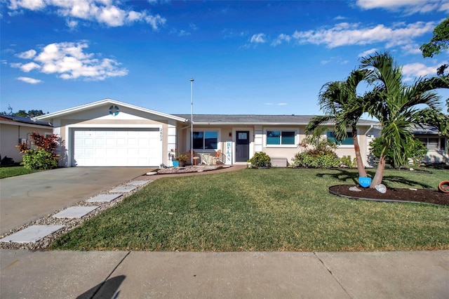 ranch-style home with a garage and a front lawn