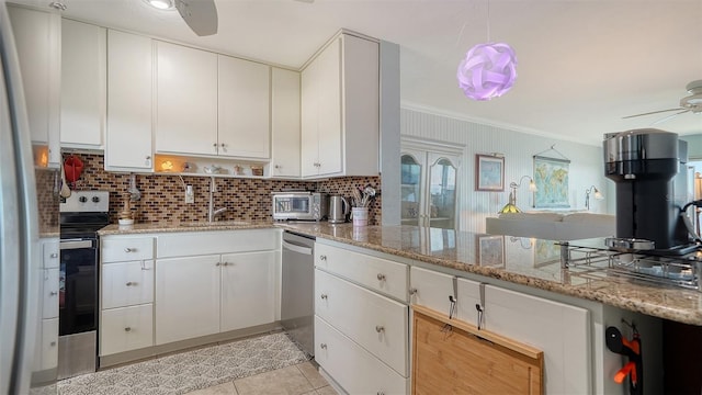 kitchen with white cabinetry, light stone countertops, stainless steel appliances, tasteful backsplash, and light tile patterned floors