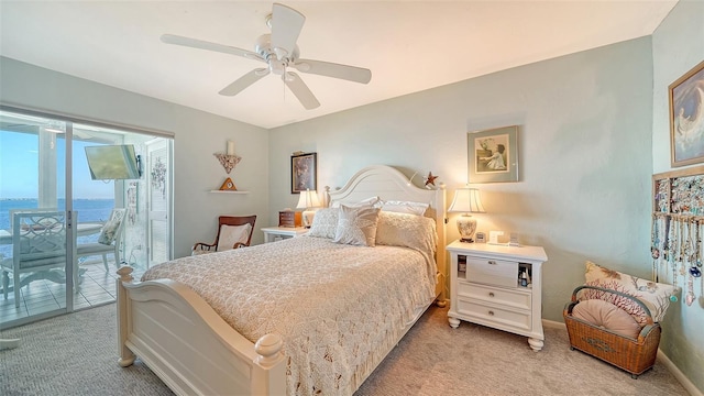 bedroom featuring light carpet, access to outside, and ceiling fan