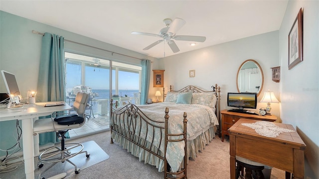 bedroom with ceiling fan, access to exterior, and light carpet