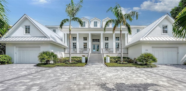 view of front of home featuring covered porch and a garage