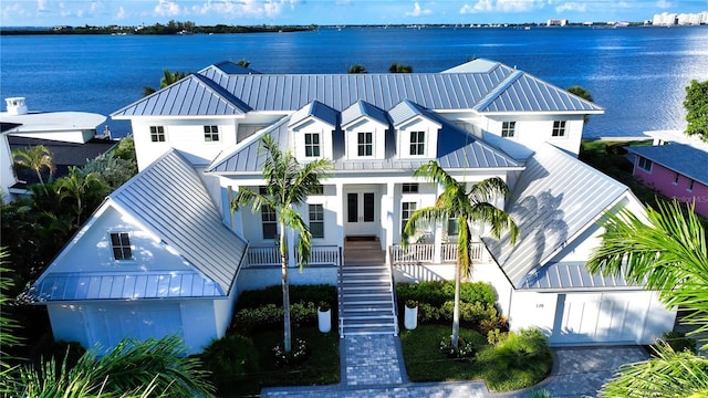 view of front facade featuring a water view and a porch