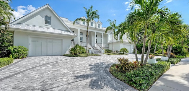 view of front of property with a garage and covered porch