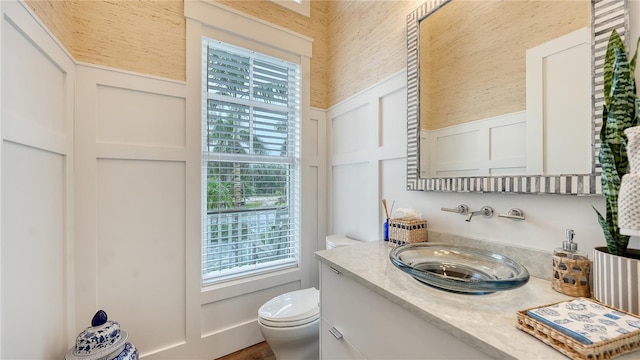 bathroom featuring vanity and toilet