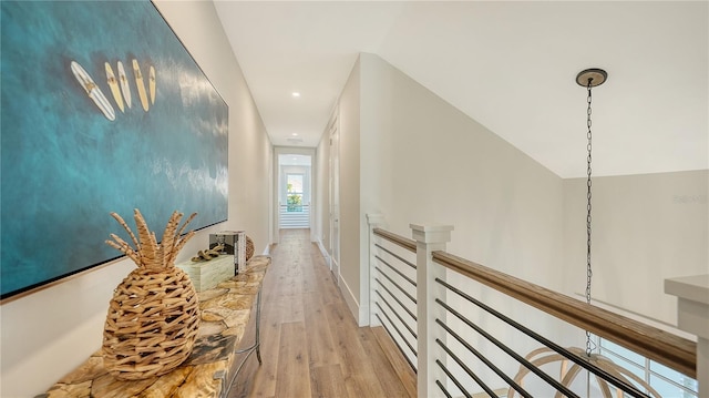 hall with light hardwood / wood-style flooring