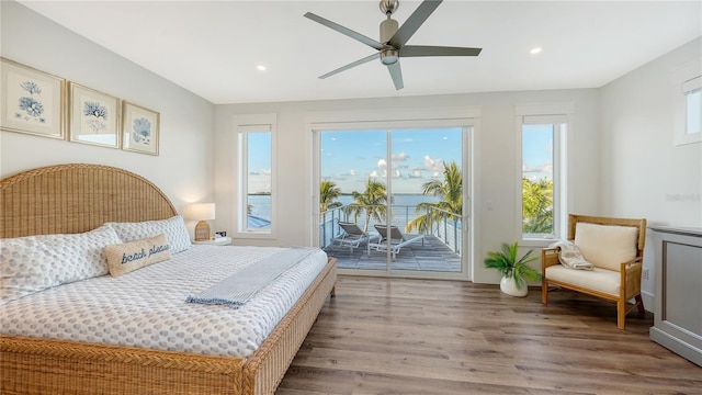 bedroom featuring access to exterior, ceiling fan, and hardwood / wood-style floors