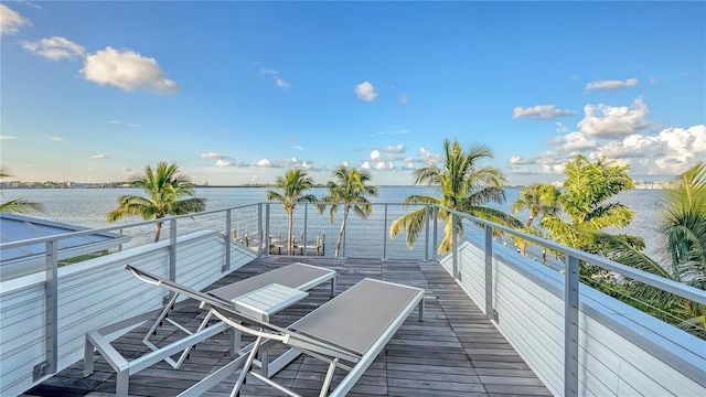 balcony featuring a water view