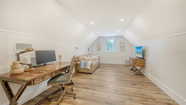 office space featuring light hardwood / wood-style flooring and vaulted ceiling