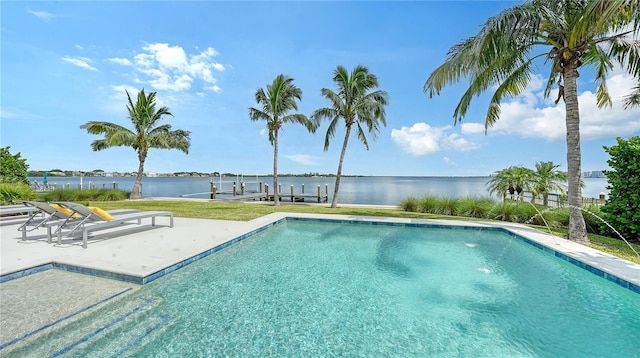 view of pool featuring a water view, a patio, and a boat dock