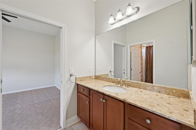 bathroom featuring vanity and ceiling fan