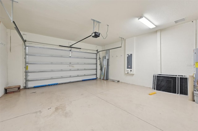 garage featuring electric panel and a garage door opener