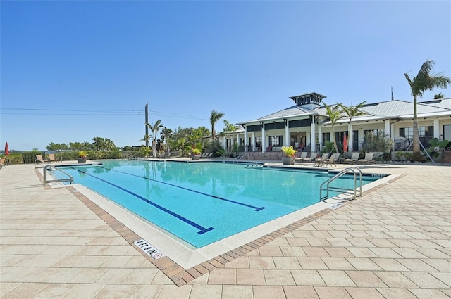 view of swimming pool featuring a patio