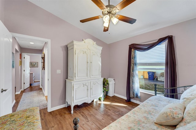 bedroom with ceiling fan and light wood-type flooring