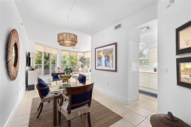 dining area featuring light tile patterned flooring