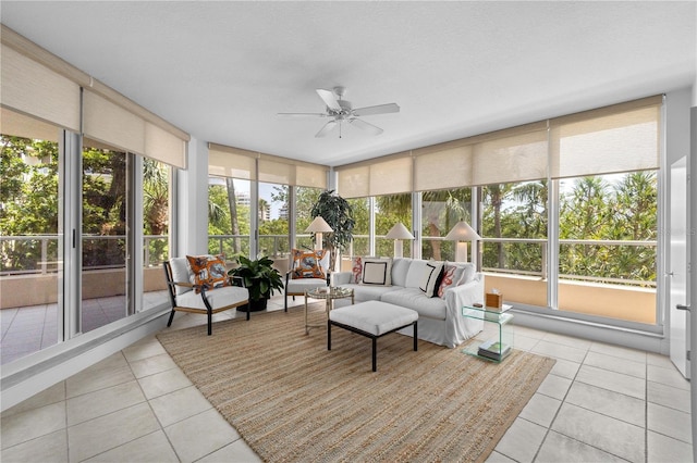 sunroom / solarium featuring ceiling fan and a healthy amount of sunlight