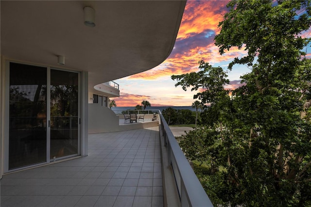 view of balcony at dusk