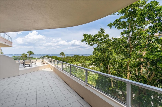 balcony featuring a water view