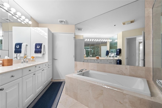 bathroom featuring vanity and separate shower and tub