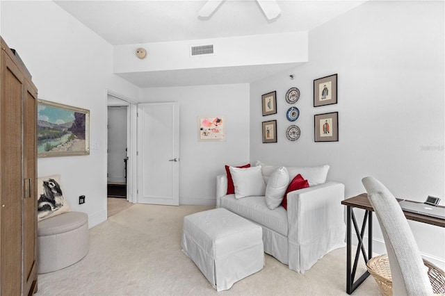 living room with ceiling fan and light colored carpet