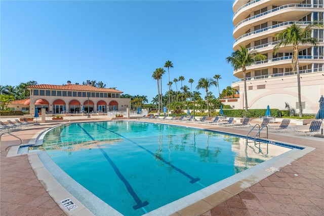 view of pool featuring a patio