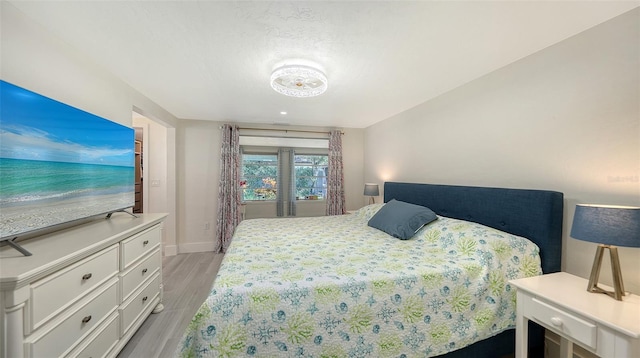 bedroom with light hardwood / wood-style flooring