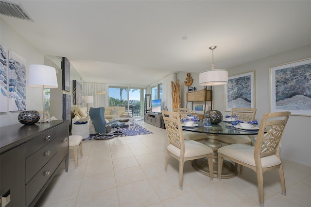 dining area with light tile patterned floors