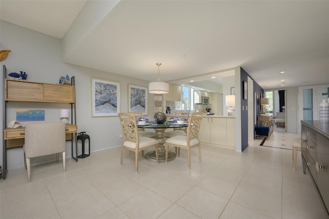 tiled dining area featuring a wealth of natural light