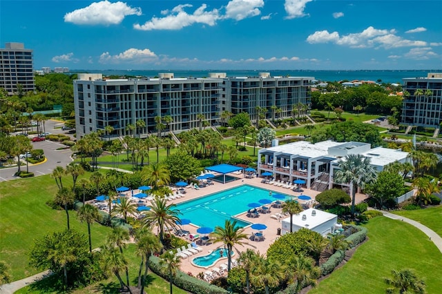 birds eye view of property with a water view