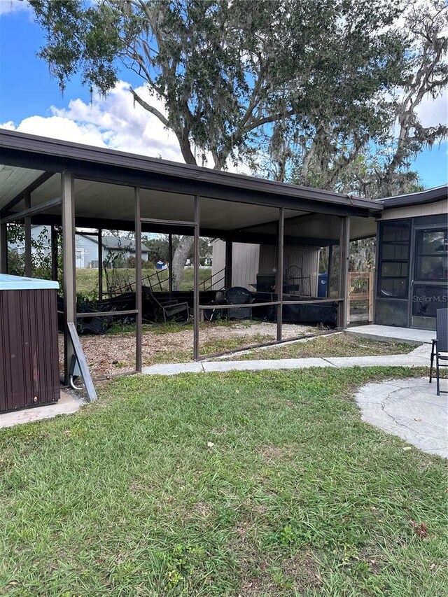 view of yard with a sunroom