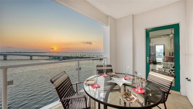 balcony at dusk with a water view