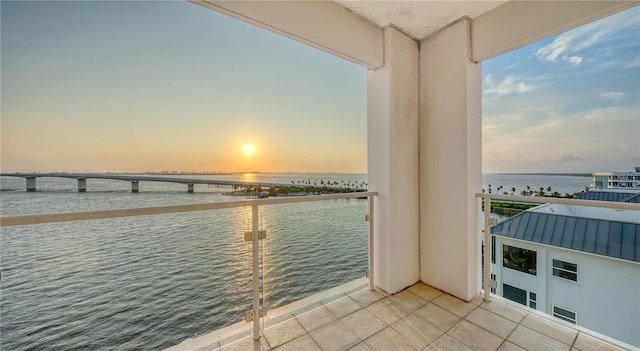 balcony at dusk with a water view