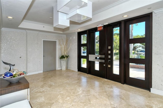 258 Golden Gate Pt Unit 801, Sarasota, FL 34236 - entrance foyer featuring crown molding, plenty of natural light, a tray ceiling, and recessed lighting