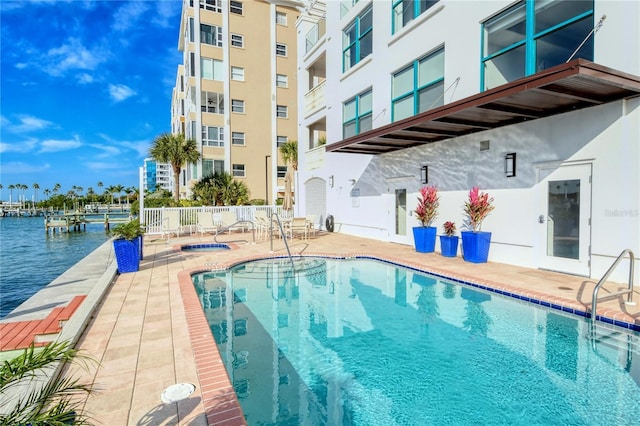 258 Golden Gate Pt Unit 801, Sarasota, FL 34236 - community pool with a patio and a community hot tub