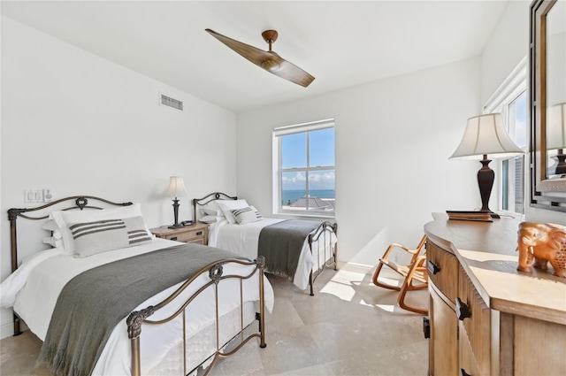 bedroom with ceiling fan and baseboards
