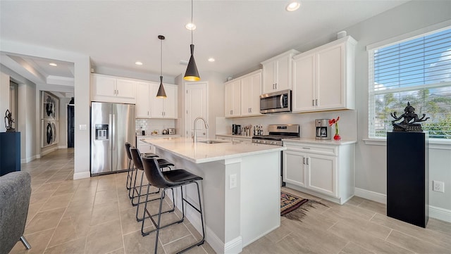 kitchen featuring white cabinetry, sink, and stainless steel appliances