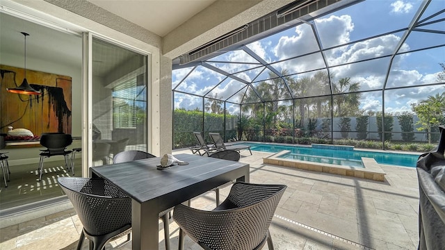 view of swimming pool with a lanai and a patio area