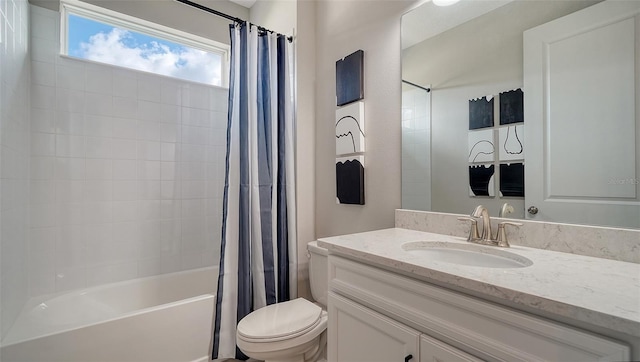 full bathroom with shower / bath combination with curtain, vanity, and toilet