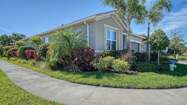 view of side of property featuring a garage