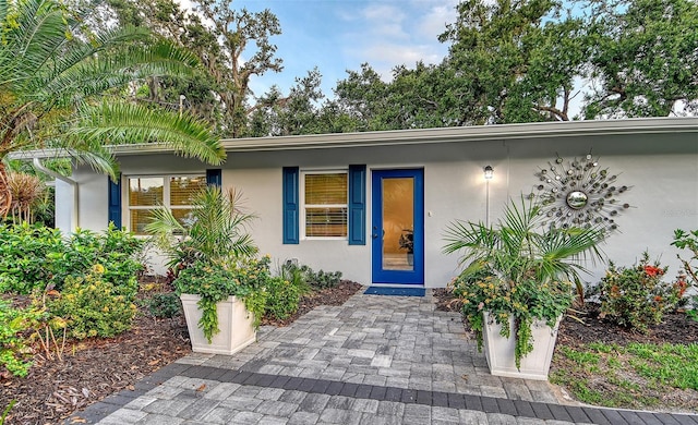 730 40th St, Sarasota, FL 34234 - doorway to property with stucco siding